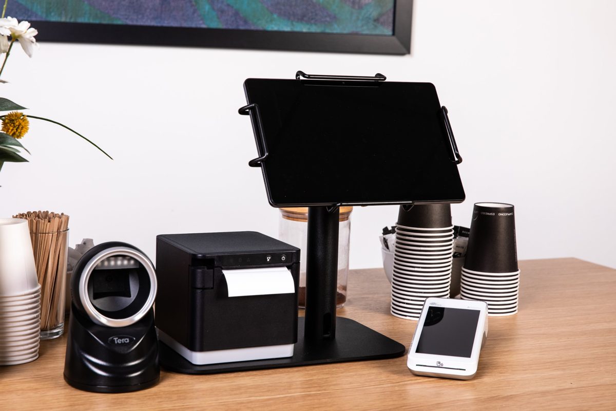 Tablet POS on a stand with receipt printer, barcode scanner and card machine